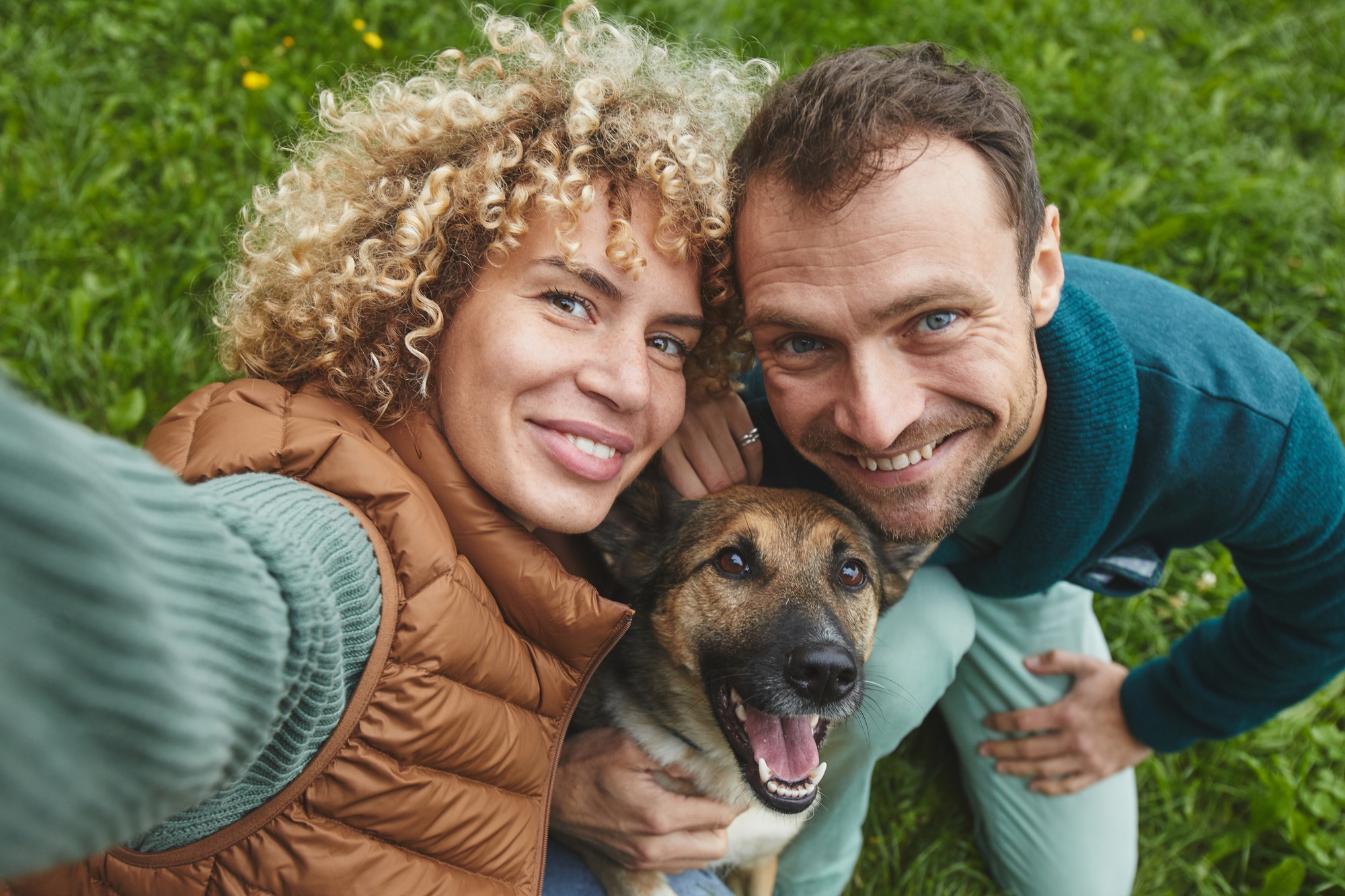 Young happy couple with dog