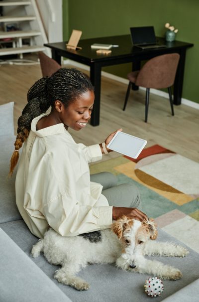 Black Woman with Pet Dog in Modern Home Black Woman with Pet Dog in Modern Home